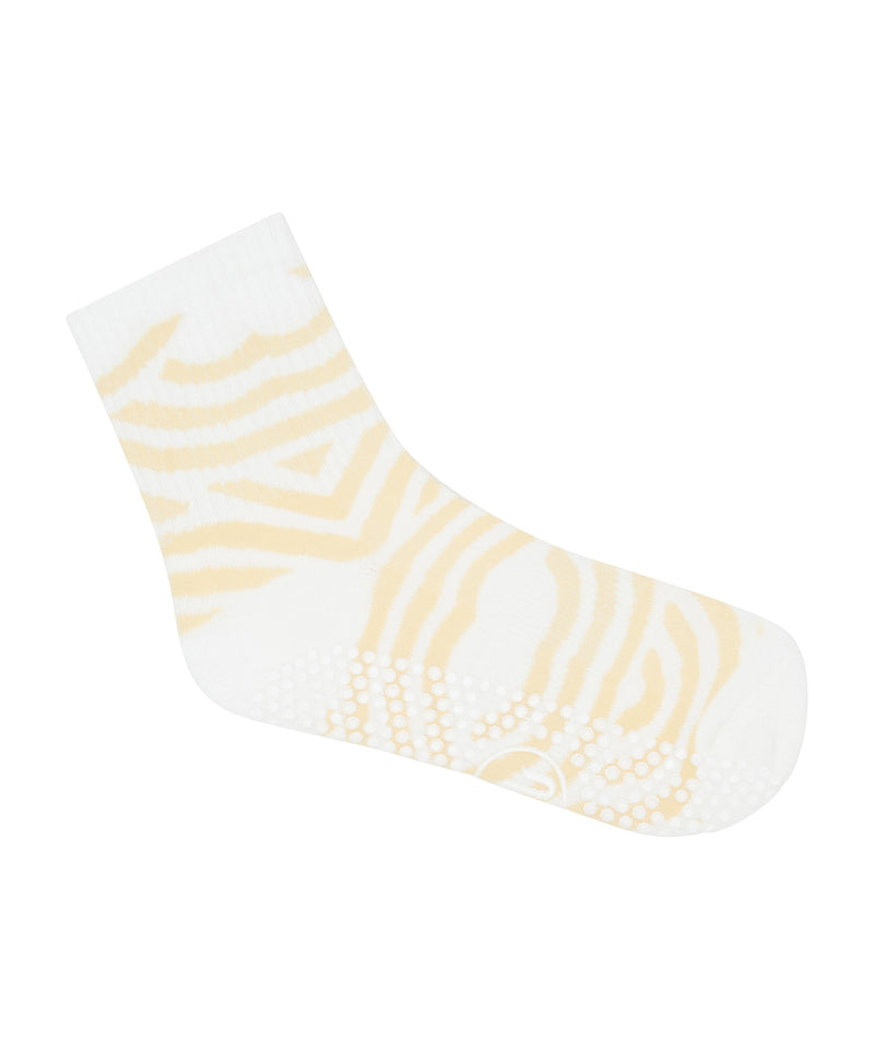 Crew length non slip socks with a stylish seashell swirl pattern