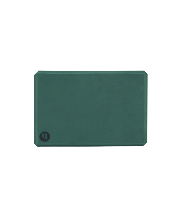 Yoga block in khaki color with a textured surface for better grip and stability during yoga practice