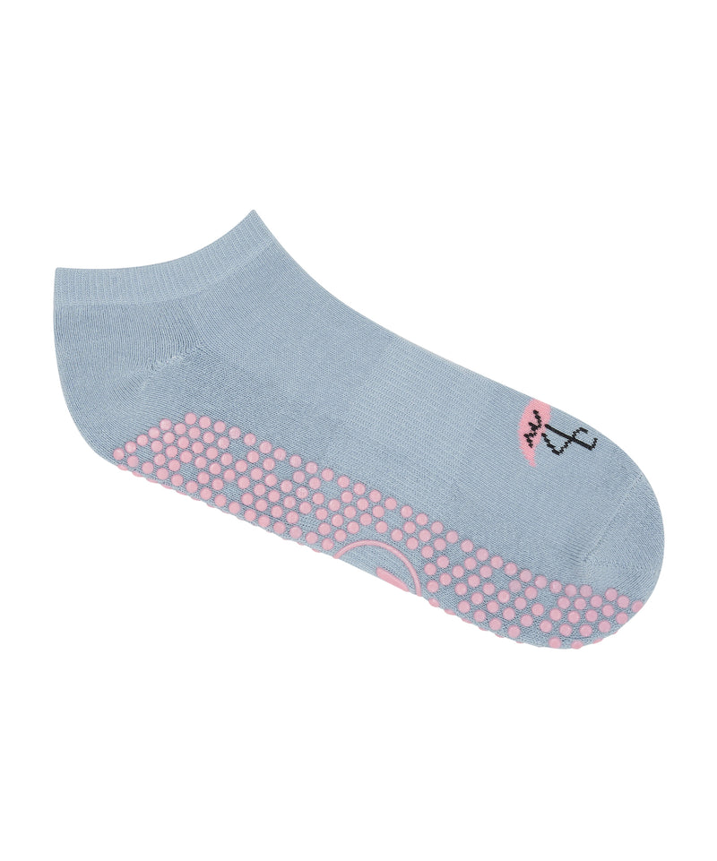  Woman wearing Classic Low Rise Grip Socks - Deco Flamingo during a barre fitness class